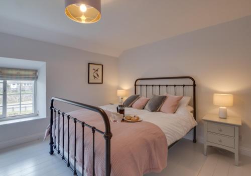 a bedroom with a large bed and a window at Stoneleigh in Hutton le Hole