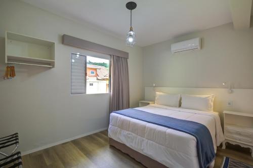 Postel nebo postele na pokoji v ubytování Filimahalo Hotel