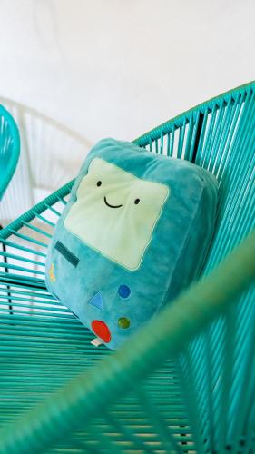 a pillow is sitting on a blue crib at Hotel Suculenta Boutique in San Cristóbal de Las Casas
