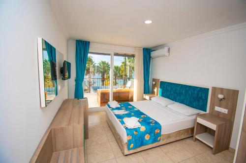 Postel nebo postele na pokoji v ubytování Sami Beach Hotel- All Inclusive