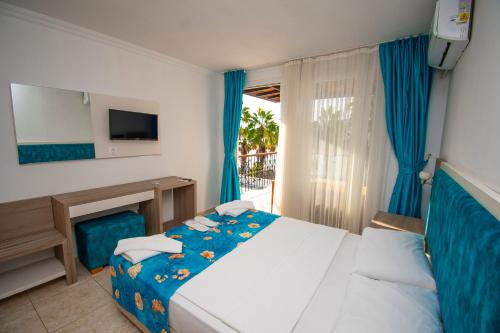 Postel nebo postele na pokoji v ubytování Sami Beach Hotel- All Inclusive