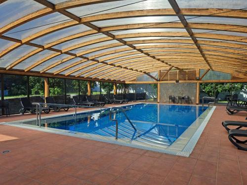 a large swimming pool with a wooden ceiling at Hotel Rural Casablanca in Los Realejos