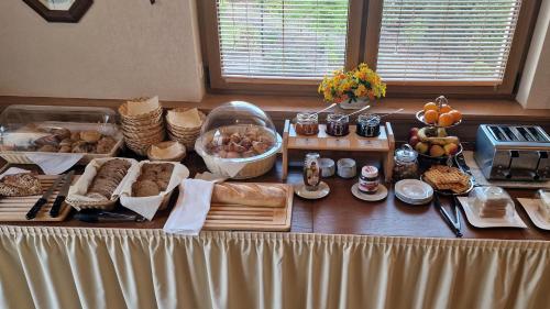 a table with bread and other foods on it at Hotel Rebstock in Baden-Baden