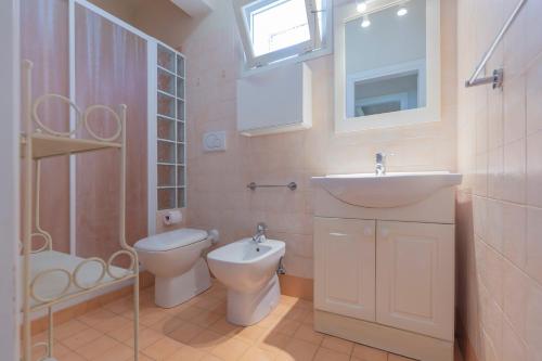 Koupelna v ubytování Villetta Capo Bianco - HelloElba