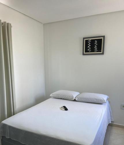Ένα ή περισσότερα κρεβάτια σε δωμάτιο στο Suítes Paju