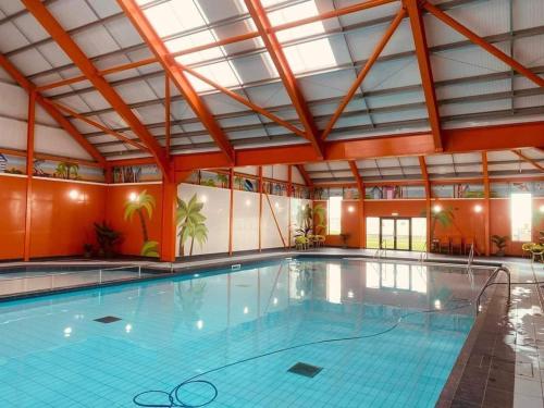 a large swimming pool in a large building at Adorable 2 bedroom holiday home in Clacton-on-Sea in Clacton-on-Sea