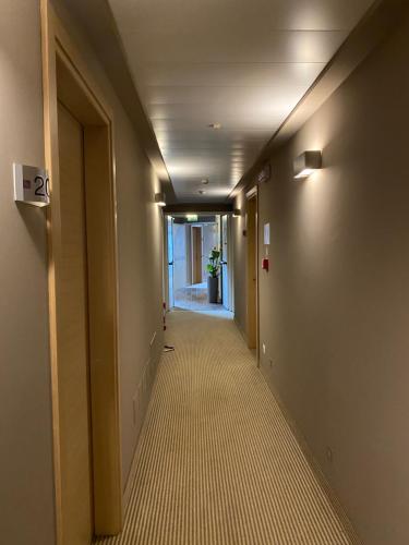 a hallway of an office building with a long corridor at Hotel Campagnola in Malcesine