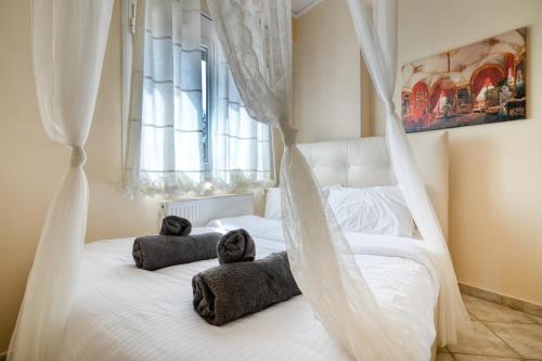 Postel nebo postele na pokoji v ubytování Votsalakia Hotel & Luxury Apartments