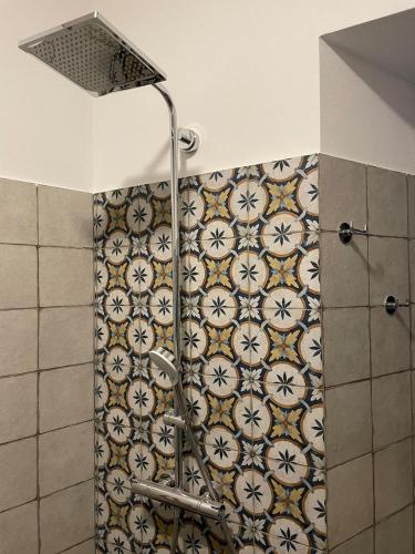 a shower with a shower curtain in a bathroom at CASA n 61 in Dervio