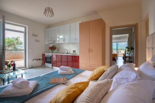 a living room with a couch and a kitchen at Princess Sissi, Villa-House with private pool and garden in Sissi
