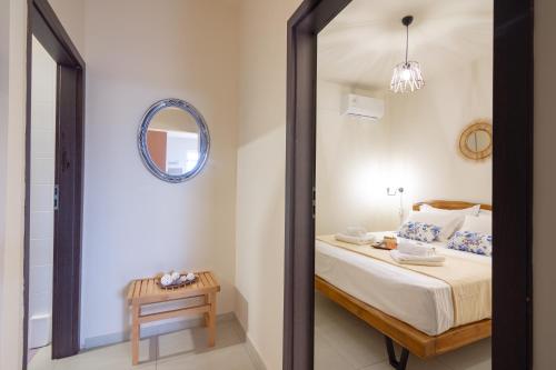 a bedroom with a bed and a mirror at Princess Sissi, Villa-House with private pool and garden in Sissi