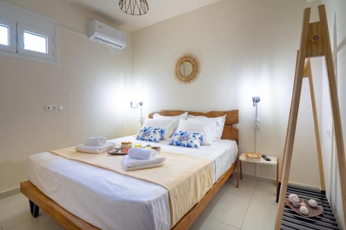 a bedroom with a large bed with towels on it at Princess Sissi, Villa-House with private pool and garden in Sissi