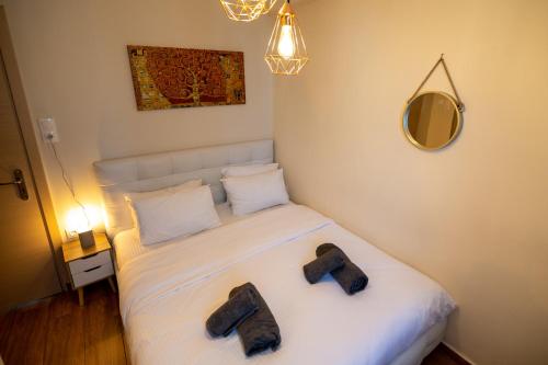Postel nebo postele na pokoji v ubytování Votsalakia Hotel & Luxury Apartments
