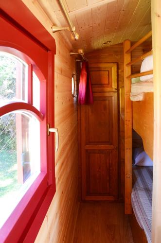 a small room with a door and a window at Logis Hôtel-Restaurant Le Relais in Hauterives