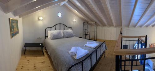 Postel nebo postele na pokoji v ubytování Casa Porphyra