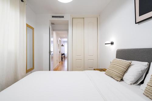 En eller flere senge i et værelse på Madrid Sur Apartments by Olala Homes
