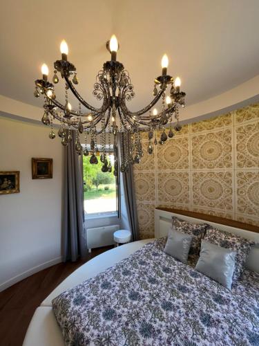Ένα ή περισσότερα κρεβάτια σε δωμάτιο στο Domaine Pierre Monnaie