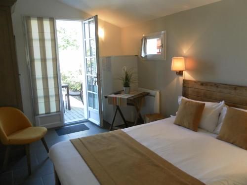 Ένα ή περισσότερα κρεβάτια σε δωμάτιο στο Hotel Residence Alaïa
