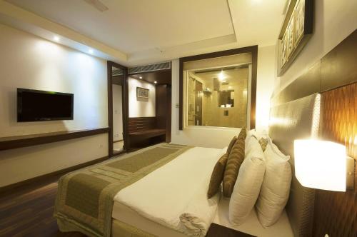 Un ou plusieurs lits dans un hébergement de l'établissement Hotel Le Roi Near New Delhi Railway Station