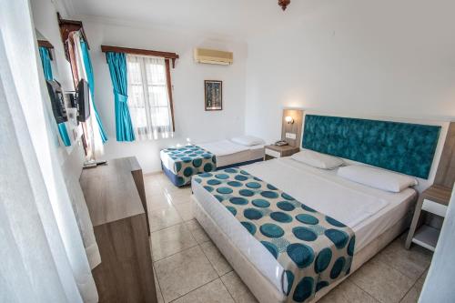 Postel nebo postele na pokoji v ubytování Sami Beach Hotel- All Inclusive