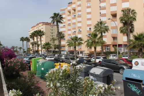 a parking lot with a bunch of parking meters at Apartamento frente al mar in Torrox Costa