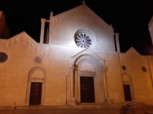 a church with a clock on the front of it at Casa Vacanza 30 in Galatina