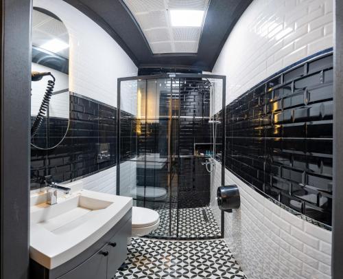 a bathroom with a shower and a sink and a toilet at İstanbul Paradise Hotel in Istanbul