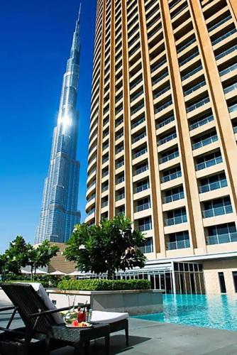a view of the burj khalifa from the courtyard of a building at Suitestay Address Dubai Mall Residence in Dubai