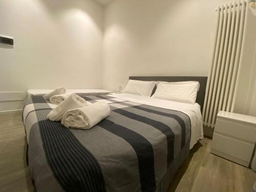 Een bed of bedden in een kamer bij Roma Loft