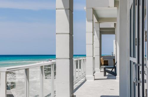 a view of the beach from the balcony of a beach house at The Pensacola Beach Resort in Pensacola Beach