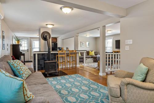 a living room with a couch and a fireplace at The Brew House - 2nd Floor Private Apartment in Portland