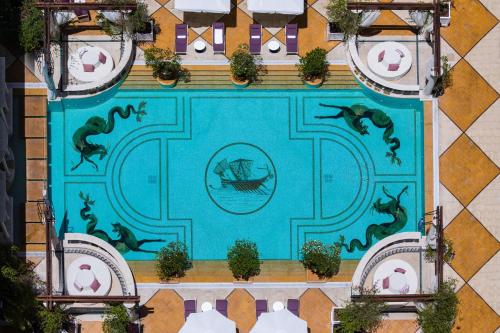 an aerial view of a swimming pool with dolphins at InterContinental Phoenicia Beirut by IHG in Beirut