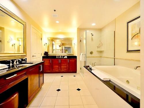 a large bathroom with a tub and a sink at Amalz Deluxe Suites at Mgm Signature ! in Las Vegas