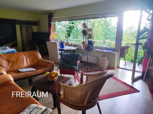 a living room with a couch and chairs at Freiraum in Küps
