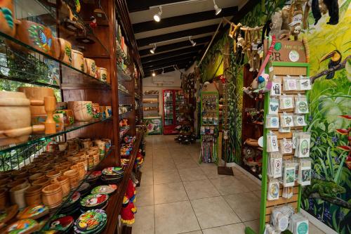 a store aisle of a store with food and other items at Parador Nature Resort and Spa in Manuel Antonio