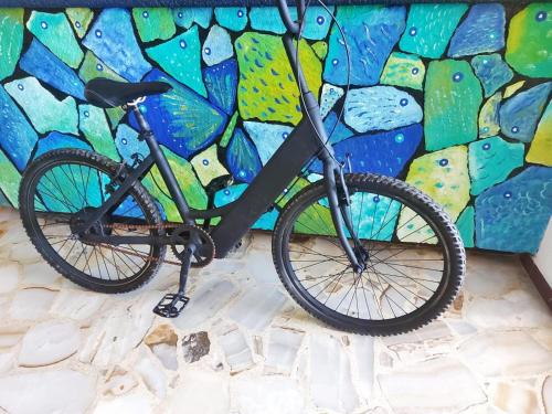 a bike parked in front of a wall at HOTEL INTI in Boca del Río