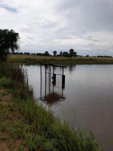 a dock in the middle of a body of water at 4 SEASONS COUNTRY CLUB in Bronkhorstspruit