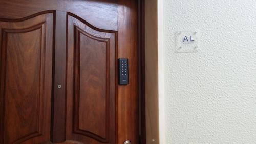 a close up of a wooden door with an all sign on it at FFoz_Spot in Buarcos