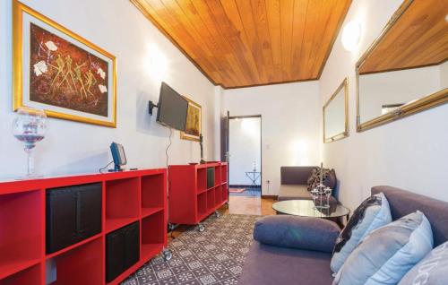 a living room with a couch and a tv at Rooms Croatia with parking, kitchen and dining area for guests in Rijeka
