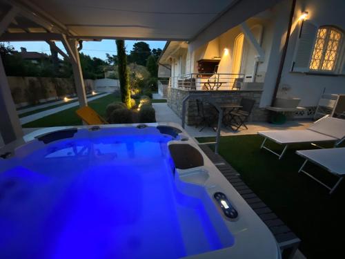 a hot tub in the backyard of a house at Bellaisa Bed & Breakfast in Camaiore