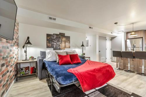 a bedroom with a blue bed with red pillows at Convenient - Near Hospitals - King Bed in Salt Lake City