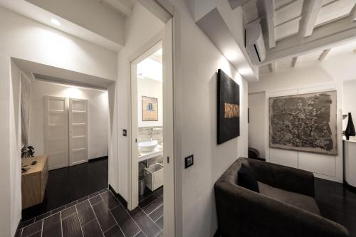 Postel nebo postele na pokoji v ubytování Barcaccia Luxury Suites