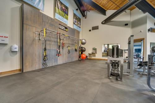 a fitness room with a gym with bikes on the wall at Durango Lofted Studio about 9 Mi to Purgatory Resort! in Durango