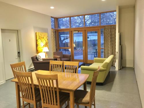 a living room with a table and chairs and a couch at Naramata Centre in Naramata