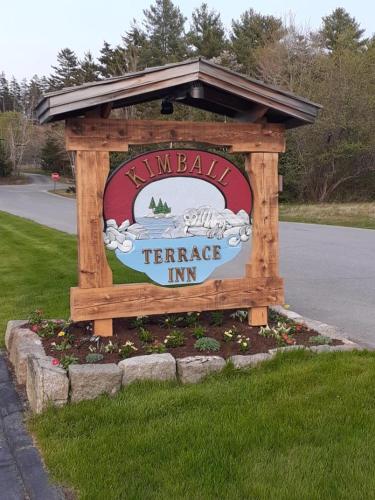 a sign for a farmers inn on the side of a road at Kimball Terrace Inn in Northeast Harbor