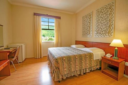 Postel nebo postele na pokoji v ubytování Hotel Monte Real