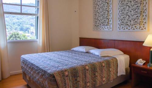 Postel nebo postele na pokoji v ubytování Hotel Monte Real