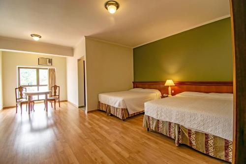Postel nebo postele na pokoji v ubytování Hotel Monte Real