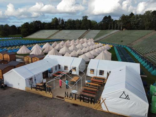 an aerial view of an amphitheater with tents at Festanation Oktoberfest Camp #2 in Munich