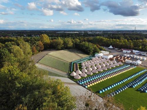 an aerial view of a garden with umbrellas at Festanation Oktoberfest Camp #2 in Munich